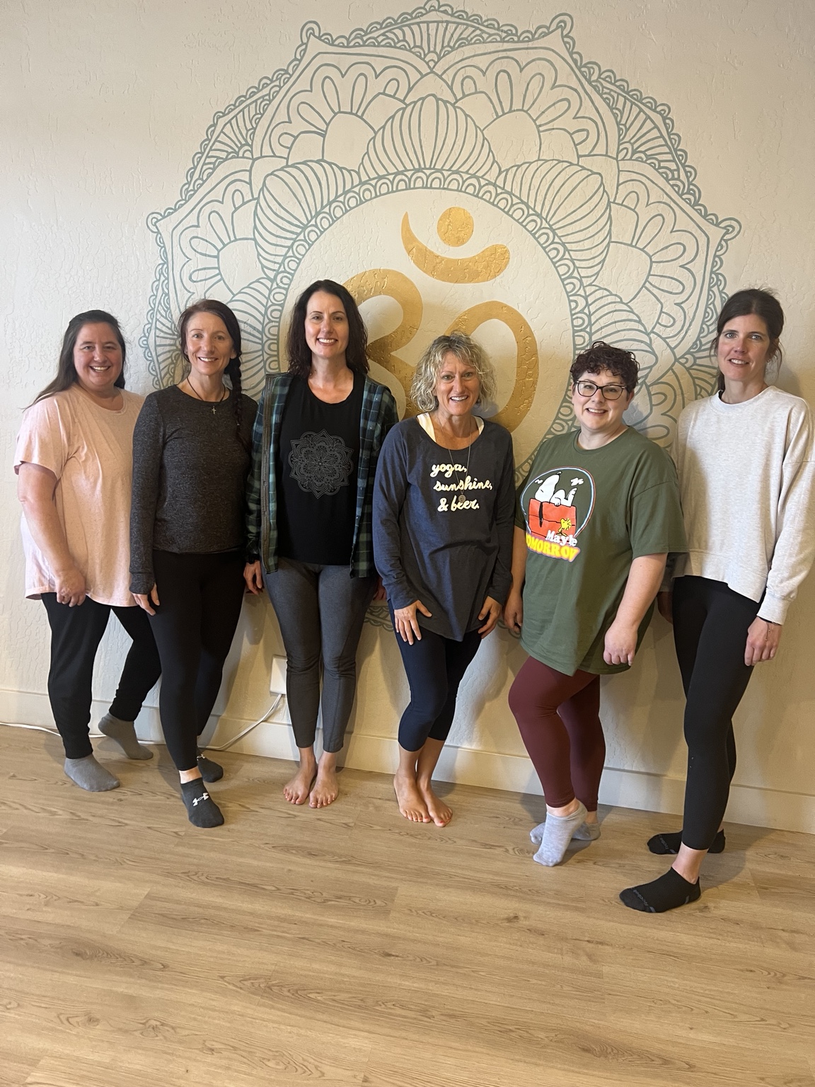 A group of women together, smiling and connecting